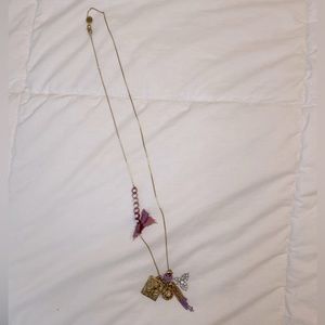 Juicy Couture charm necklace. Gold with purple detailing.